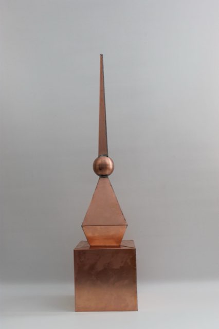 Hand-formed copper finial showing folds and soldered seams